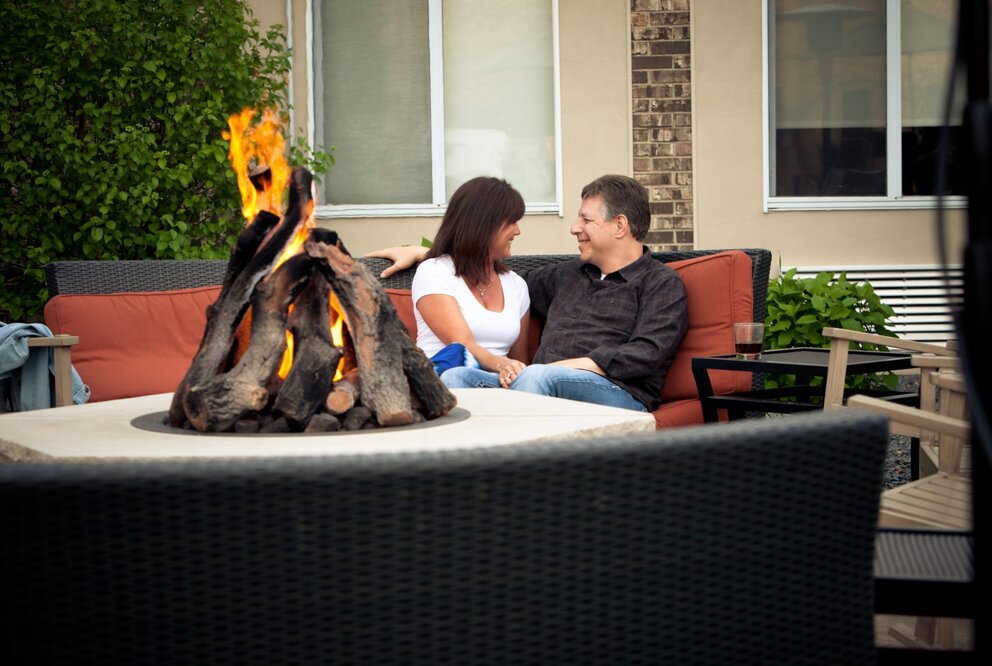 Couple at Firepit at Hotel Marshfield
