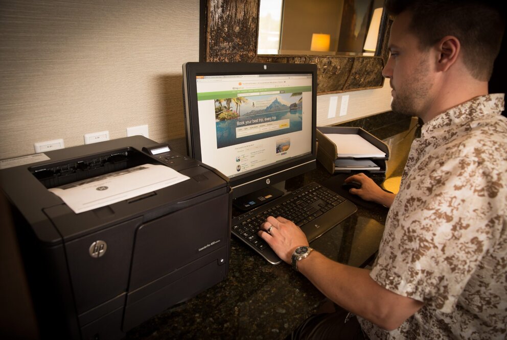 Man using Business Center at Marshfield Hotel