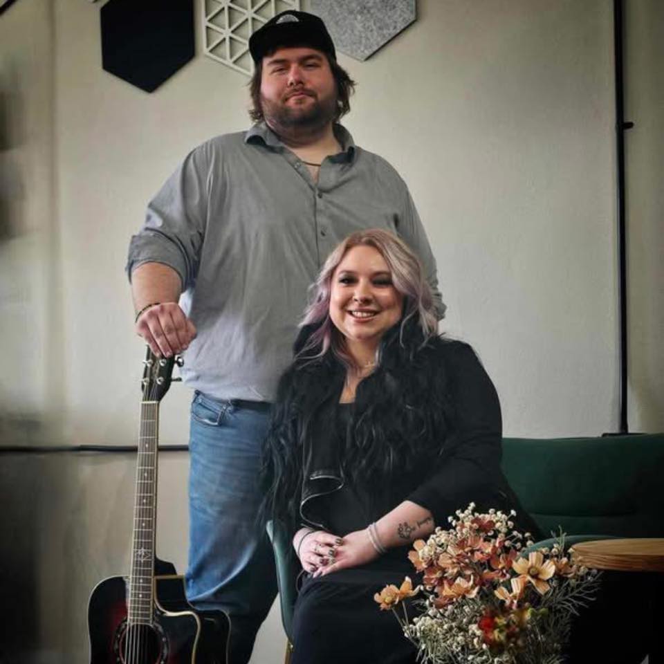 a man and woman posing for a picture