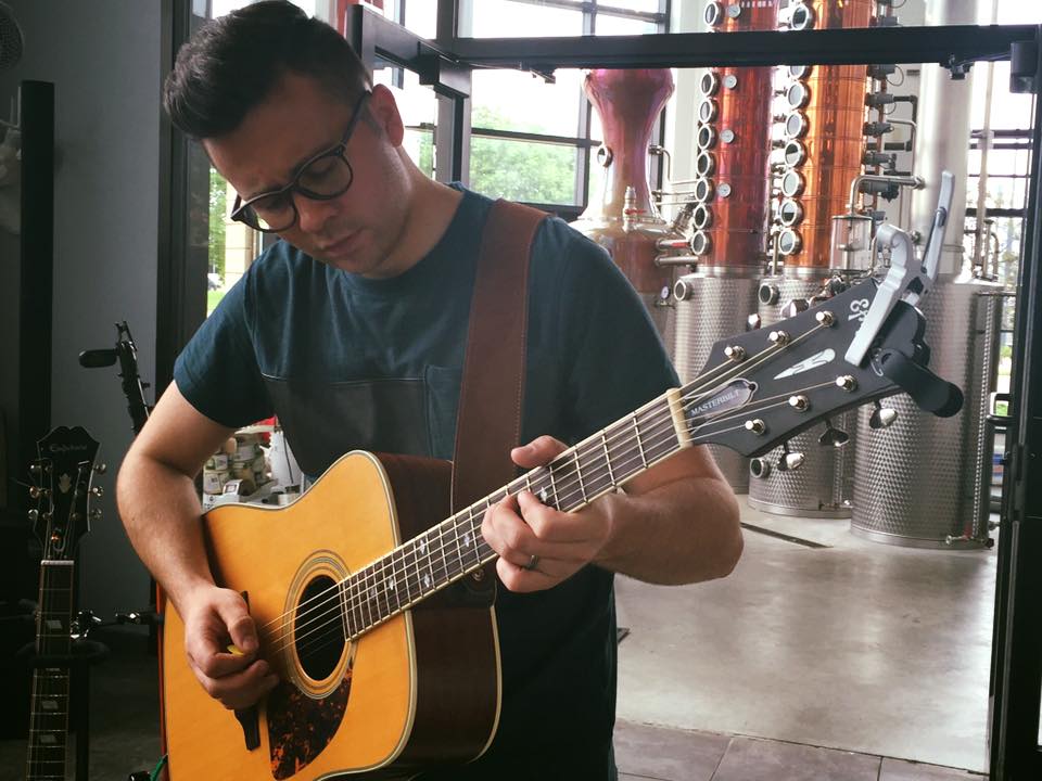 a man playing a guitar